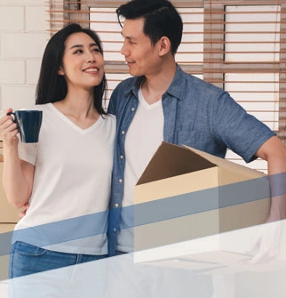 Asian couple with moving boxes