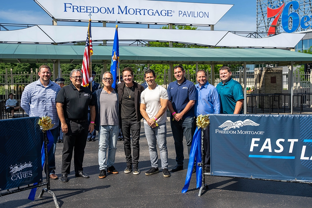Stan with his two sons, Michael and Greg, alongside Freedom Mortgage Executives David Sheeler and Mike Patterson, Live Nation Executives Geoff Gordon and Chris Collins, and the lead singer of Train, Pat Monahan Stan with his two sons, Michael and Greg, alongside Freedom Mortgage Executives David Sheeler and Mike Patterson, Live Nation Executives Geoff Gordon and Chris Collins, and the lead singer of Train, Pat Monahan