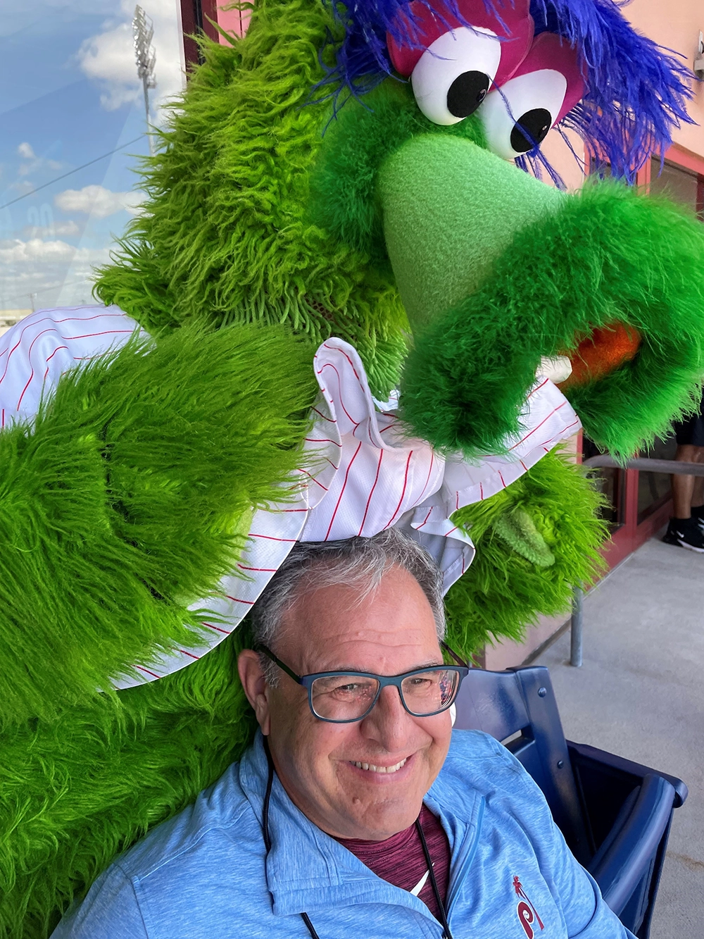 While supporting his hometown baseball team, Stan received some attention from Phillie Phanatic, the team's mascot While supporting his hometown baseball team, Stan received some attention from Phillie Phanatic, the team's mascot