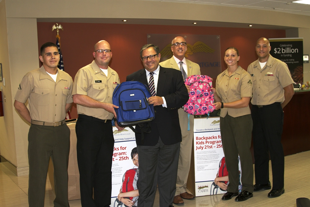 Stan at a Rucksacks to Backpacks distribution event with a few members of the Marine Corps in 2014 Stan at a Rucksacks to Backpacks distribution event with a few members of the Marine Corps in 2014